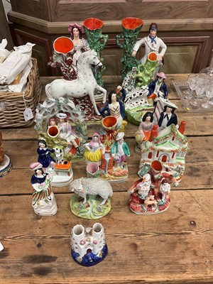 Lot 41 - Group of 19th century Staffordshire pottery flatback figures, figure groups and spill vases (14)