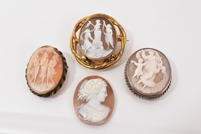 Lot 113 - Victorian carved shell cameo in a gilt metal brooch mount, together with two other cameo brooches and one unmounted (4)