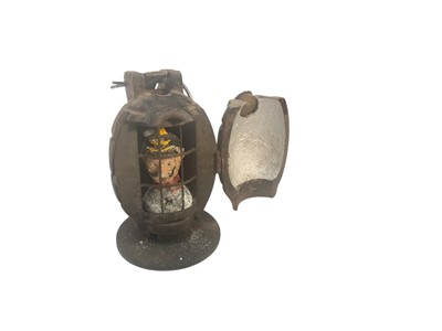 Lot Amusing First World War Mills Bomb hand grenade, with hinged door opening to reveal Kaiser Wilhelm behind bars, mounted on circular base, 10cm in overall height.