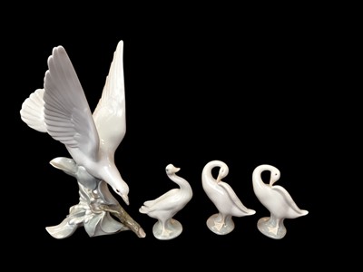 Lot 1262 - Lladro porcelain seagull, together with three Lladro geese