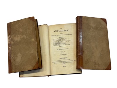 Lot 1565 - The Antiquary by Sir Walter Scott. Second edition published in 1816 in 3 volumes, in contemporary quarter calf bindings