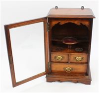 Lot 1073 - Late Victorian oak smokers cabinet with glazed...