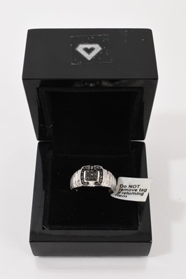 Lot 134 - Gentlemen's 9ct white gold ring with a square plaque set with black stones, new with tag and box