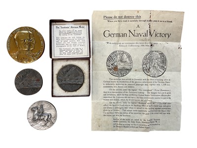 Lot Group of four medals / medallions to include two R.M.S. Lusitania medals, one boxed, a Jutland medal, and a Verdun medal (4).