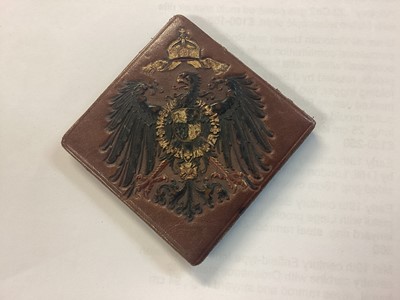 Lot 814 - Unusual Imperial German miniature czapska, together with a miniature pickelhaube and a folding leather coin purse with Imperial German arms (3).