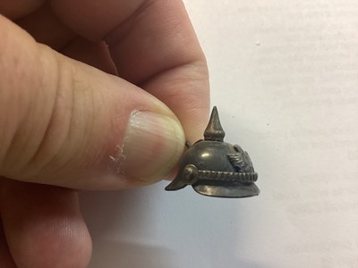 Lot 814 - Unusual Imperial German miniature czapska, together with a miniature pickelhaube and a folding leather coin purse with Imperial German arms (3).