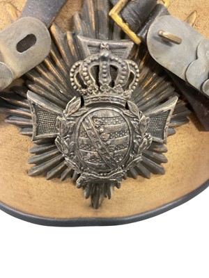 Lot 825 - Scarce Imperial German Saxony Reserve Officers ersatz busby with canvas covered body, silvered and gilt two part helmet plate, silvered chin scales, silver bullion and red felt bag and original...