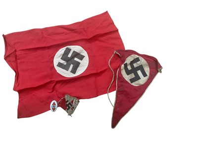 Lot 714 - Nazi pennant together with a Nazi Hitler Youth fabric badge, another Hitler Youth badge and a small cloth swastika flag.