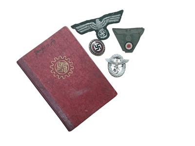 Lot 715 - Group of three Nazi German badges, together with a Nazi N.S.B.O. booklet, and an enamel N.S.D.A.P. party members badge, (5).