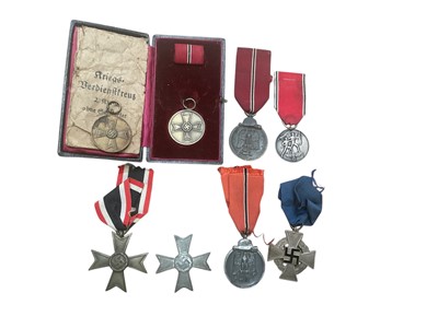 Lot 718 - Group of Nazi German medals to include Commemorative Medal of 13th Marc 1938, Faithful Service Decoration and two War Merit Crosses (8).