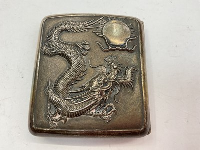 Lot 1099 - Late 19th/early 20th century Chinese silver cigarette case, with embossed dragon cover and stork and Iris underside.