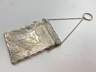 Lot 1100 - Late Victorian silver card case, with engraved floral decoration and initials, hinged opening cover and suspension chain