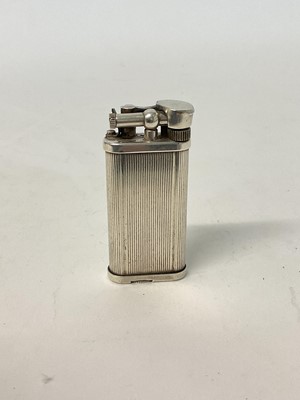 Lot 115 - Vintage Dunhill pocket lighter with ribbed all-over decoration