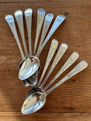 Lot 143 - Set of six George III silver bright cut teaspoons (London 1788) and four similar examples (London 1786), all at 3.3ozs