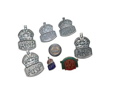 Lot 756 - Group of five Second World War silver ARP badges, together with an Air Raid Defence League enamel badge and two further enamel badges (8).