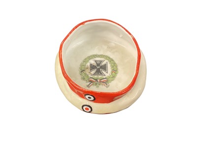 Lot 842 - Imperial German novelty porcelain ashtray in the form of a Garde du Corps field cap with polychrome printed First World War Iron cross within wreath to centre, 11cm