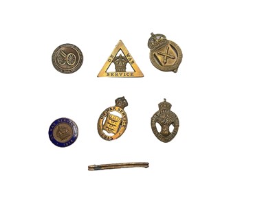 Lot 758 - Group of seven First World War War Service badges to include a Coventry Ordnance Works Special War Service badge, Board of Agriculture Land Worker badge and a wound stripe (7).