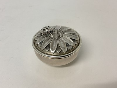 Lot 34 - Asprey silver box and cover, the cast silver lid with a sunflower and ladybird, made and retailed by Asprey, London 1998.