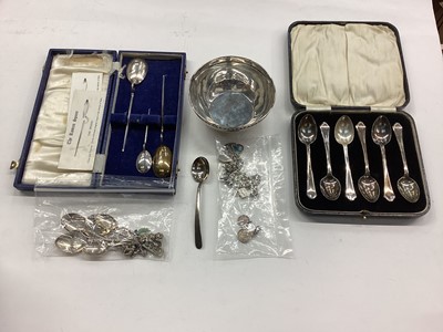 Lot 1066 - Group of silver to include three silver 'Roman spoons', silver bowl with spoon, set of six silver teaspoons in case, silver souvenir spoons and a silver charm bracelet.