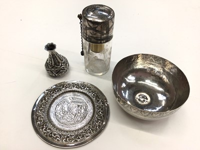 Lot 259 - Four Eastern white metal items to include a glass perfume bottle, pin dish, small bowl and a miniature bottle vase