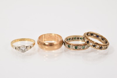 Lot 179 - 18ct gold diamond single stone ring in platinum setting, 9ct gold wedding ring and two 9ct gold gem set eternity rings (4)