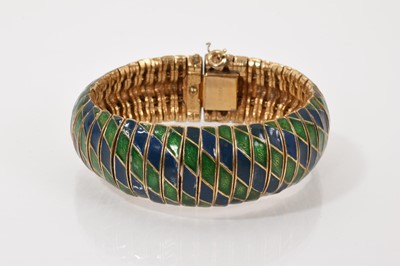 Lot 238 - American vintage gilt metal, blue and green enamel articulated bracelet by Ciner, 18.5cm long