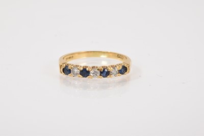 Lot 217 - Sapphire and diamond seven stone half eternity ring in 18ct gold setting