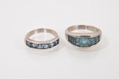 Lot 219 - White gold blue topaz seven stone ring (stamped 750), size R, together with a similar blue topaz ring, size P (2)