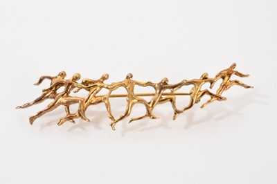 Lot 272 - Ilias Lalaounis silver gilt Olympic brooch depicting a line of abstract running figures, 9cm