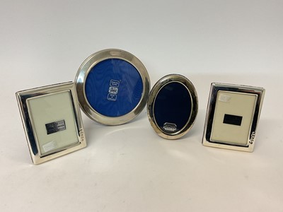 Lot 80 - Four small silver photographs frames, including a pair to hold 3 1/4" x 2 1/2" photos, all boxes