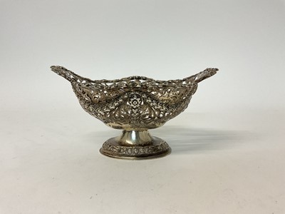 Lot 112 - Victorian silver bonbon dish, of lozenge form, on footed base, with pierced swag decoration, Chester 1890 (George Nathan & Ridley Hayes), 17cm wide, 6.6 troy oz