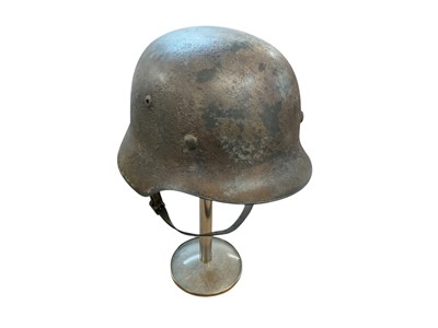 Lot 896 - Second World War Nazi German M35 Luftwaffe helmet, stamped under brim 'ET-64', with leather lining and chin strap.