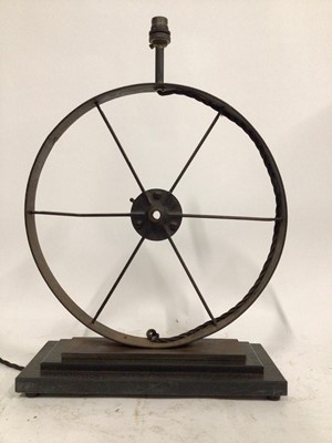 Lot 113 - Industrial Wheel lamp, 53cm high to top of light fitting, wheel diameter 38cm on 36cm x 15cm base