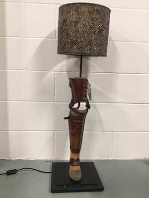 Lot 125 - Vintage Prosthetic Leg lamp with Guinea fowl drum shade, 104cm high with shade, on 30cm x 30cm base