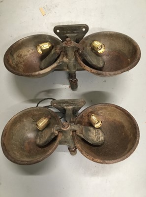 Lot 130 - Pair Old Cattle drinking bowls up or down lights, 57cm across, each bowl 25cm in diameter, with triangular wall fixing