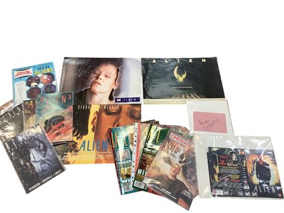 Lot 1475 - Film Memorabilia Aliens items include HR Giger signed VHS video, an album of coloured photographs, signed photographs and pieces, Alien publications, small posters etc.