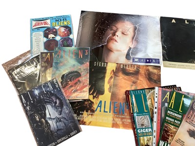 Lot 1475 - Film Memorabilia Aliens items include HR Giger signed VHS video, an album of coloured photographs, signed photographs and pieces, Alien publications, small posters etc.