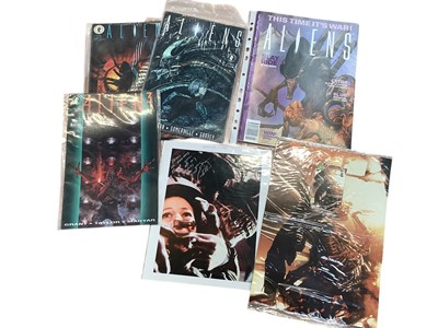 Lot 1475 - Film Memorabilia Aliens items include HR Giger signed VHS video, an album of coloured photographs, signed photographs and pieces, Alien publications, small posters etc.