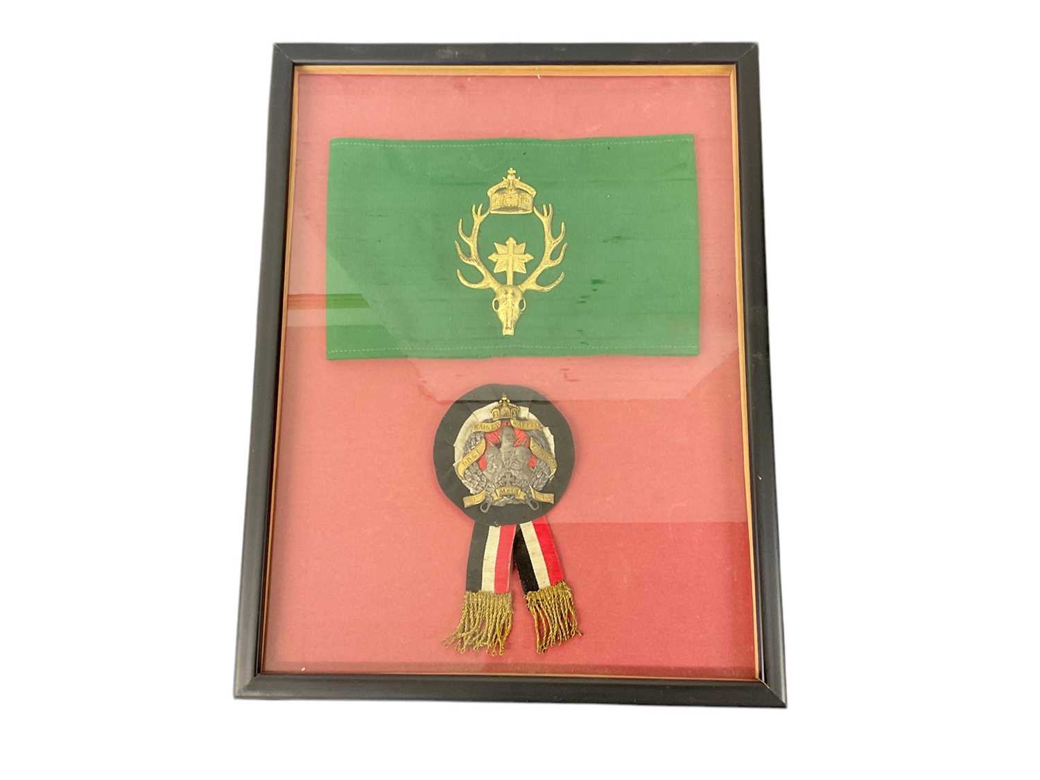 Lot 867 - Imperial German Hunting Society of St. Hubert armband with gilt metal crowned stags head badge on green silk band and Imperial German veterans association badge (2) in glazed frame