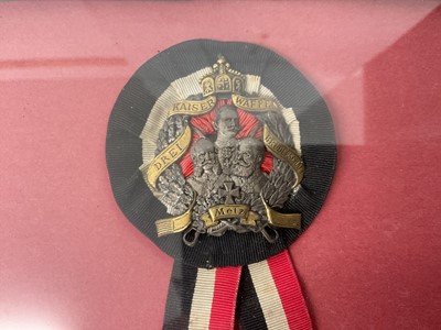 Lot 867 - Imperial German Hunting Society of St. Hubert armband with gilt metal crowned stags head badge on green silk band and Imperial German veterans association badge (2) in glazed frame