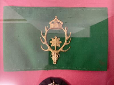 Lot 867 - Imperial German Hunting Society of St. Hubert armband with gilt metal crowned stags head badge on green silk band and Imperial German veterans association badge (2) in glazed frame