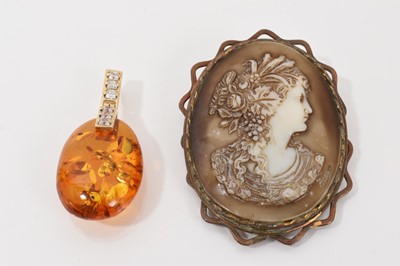 Lot 287 - 14ct gold mounted amber and gem set pendant, together with a cameo brooch (2)