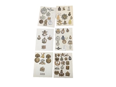 Lot 778 - Group of five boards mounted with a selection of British Military cap badges to include Parachute Regiment, The Royal Dragoons and The Middlesex Regiment.