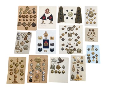 Lot 781 - Group of thirteen boards mounted with a selection of British Military cap badges and buttons to include Machine Gun Corps, Royal Engineers and Red Cross.