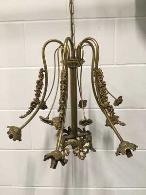 Lot 154 - Brass Ormolu Chandelier with flower garlands, together with a Black wrought iron chandelier. The first 42cm x 50cm with chain (90cm) on ceiling fixing 10cm diameter, the second 53cm x 60cm, on...