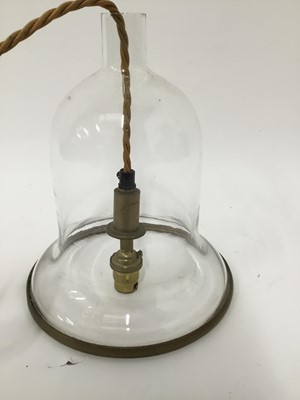 Lot 161 - Glass hanging lantern of bell form with brass band on gold hanging cord with brass ceiling rose. 26cm x 20cm.