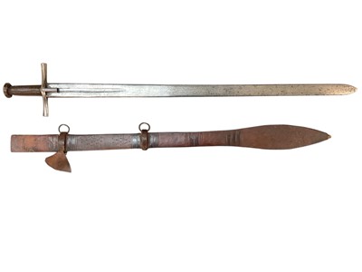 Lot 957 - 19th century Sudanese Kaskara sword with cruciform hilt, broad tapering double edged fullered blade in tooled leather covered scabbard with swollen tip