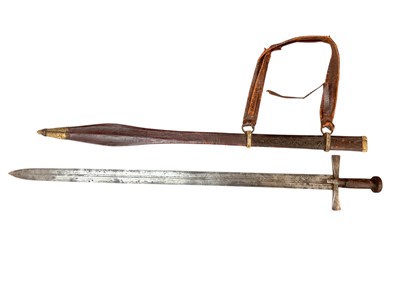 Lot 958 - 19th century Sudanese Kaskara sword with cruciform hilt, broad tapering double edged fullered blade in tooled leather covered scabbard with swollen tip