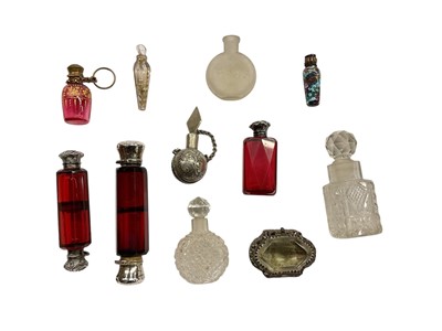 Lot 1091 - Collection of silver mounted scent bottles and similar items