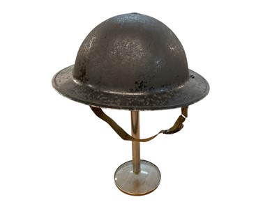 Lot 792 - Second World War British MK II steel helmet, dated 1939, together with a British MK I steel helmet shell (2)